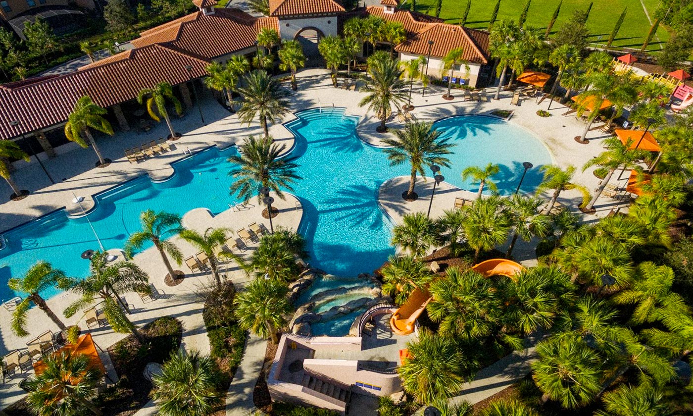 Big pool surrounded by palm trees at Solterra Resort