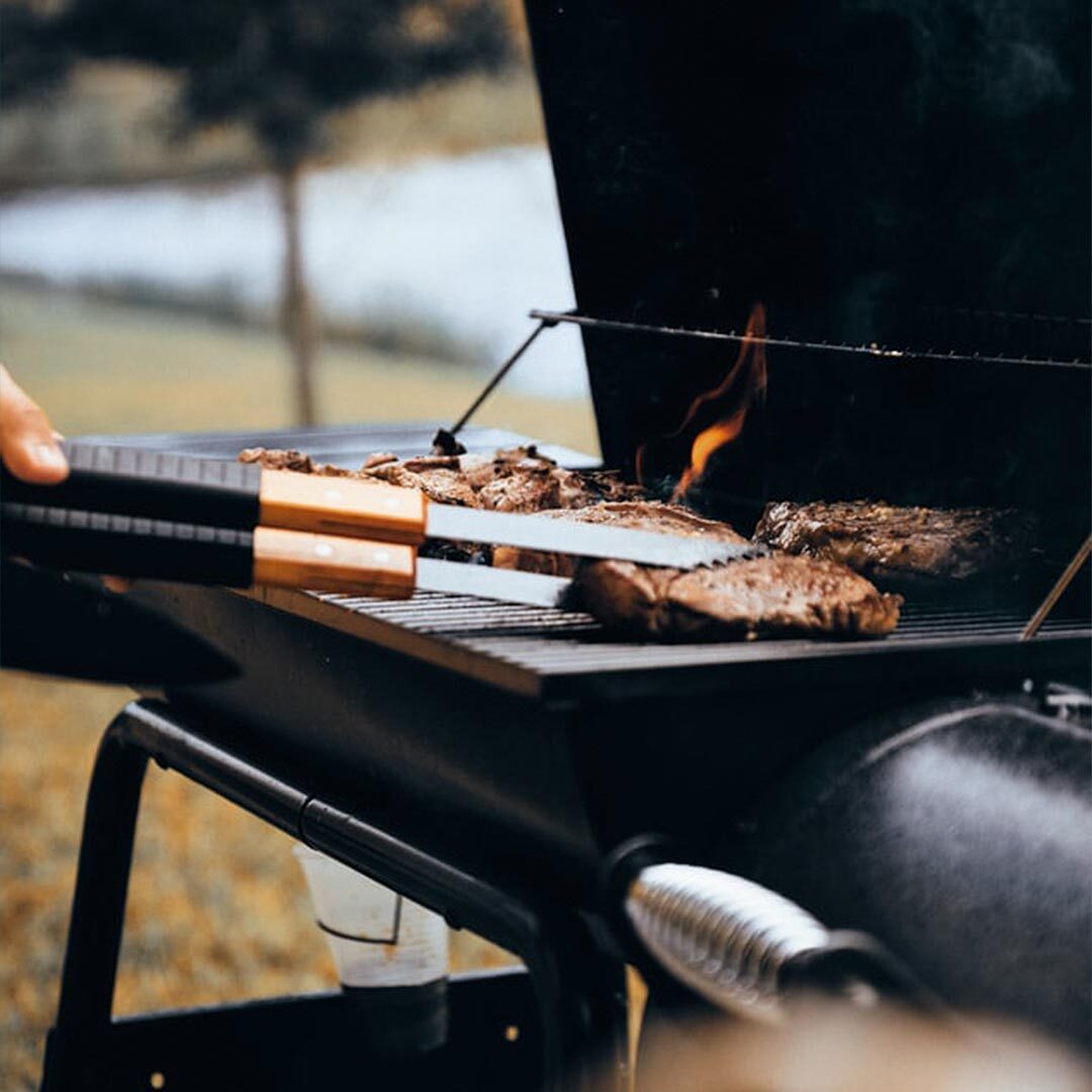 burgers grilling on a burner BBQ